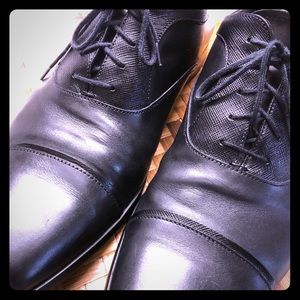 Mens black Prada cap-toe oxfords in black